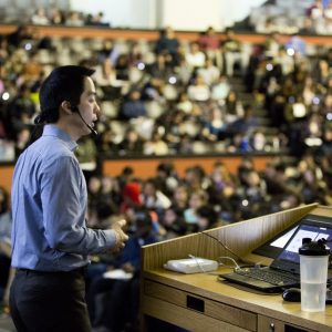 Kenneth Yip lecturing at Convocation Hall. Photo by Johnny Guatto